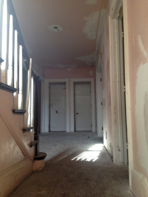 Entering through the west side of the house, this the view. The kitchen and dining room are to your right; the living room will be toward your left.