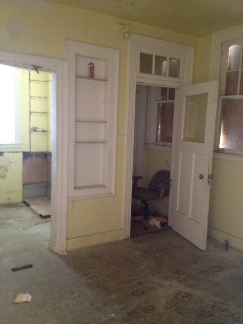 This is the kitchen. That back area you see behind the built ins has to be torn off. It was a tiny kitchen.